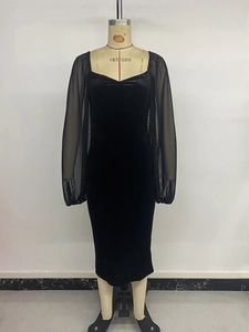 Detail of elegant velvet dress with sheer mesh puff sleeves and sweetheart neckline