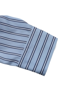 Detail of striped shirt cuff featuring horizontal and vertical stripe patchwork design