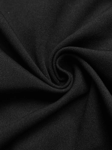 Close-up of elegant black striped patchwork fabric with premium knitted texture detail