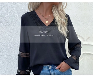 Close-up of black V-neck top featuring intricate lace hollow-out details and long sleeves