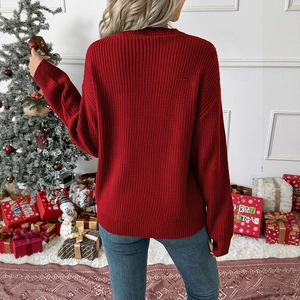 Detail of dark red knit sweater showing the back fit and cozy ribbed texture