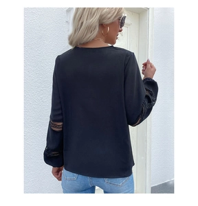 Detailed back view of a black V-neck long-sleeve shirt with intricate lace hollow-out sleeves