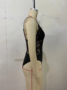 Detail of black lace bodysuit with delicate eyelash lace edges and slim straps