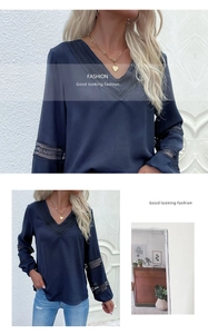 Detailed view of the dark blue V-neck blouse featuring intricate black lace trim and hollow out