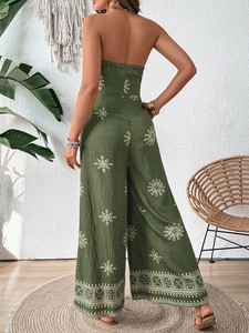 Detail of army green strapless jumpsuit with white bohemian prints and wide leg design