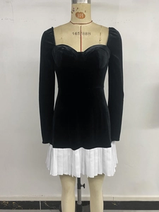 Detail of velvet bodice with sweetheart neckline and contrasting pleated white skirt