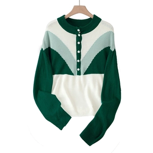 Women's casual knit sweater with V-shaped green and white color block and button detail