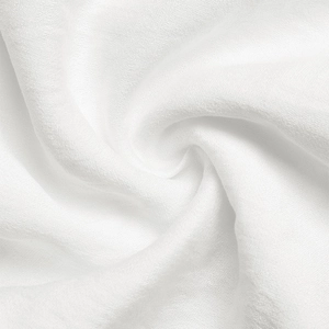 Detailed macro view of white lace fabric with breathable mesh texture and spiral fold design