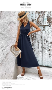 Detailed side view of the navy blue V-neck maxi dress with high waist and side slit design