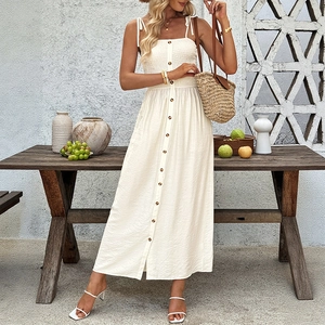 Elegant beige smocked midi sundress with button front and adjustable bow straps