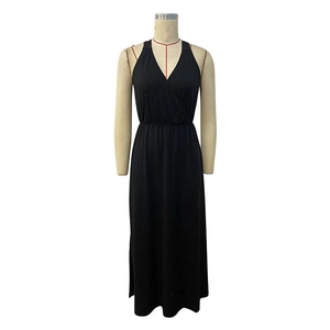 Detailed view of the deep V-neckline and elastic waist on this black maxi dress
