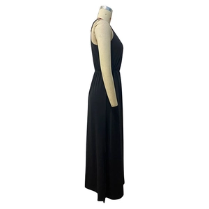 Side view of a black sleeveless maxi dress with waist cinching on a mannequin