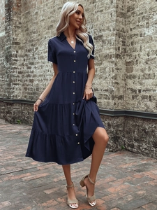 Detail of navy blue short sleeve button-up midi shirt dress with vintage textures