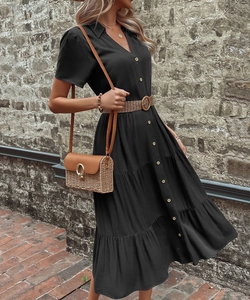 Detail of black V-neck button-down dress with woven straw belt and ruffled hemline