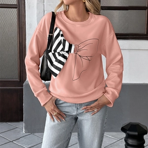Detail of pink long-sleeve sweatshirt featuring 3D striped fabric bow and line art design