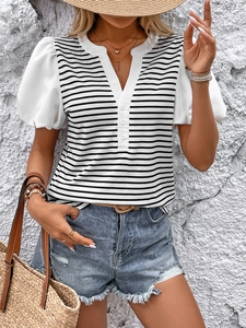 Detail of summer striped T-shirt with puff sleeves and casual denim shorts set
