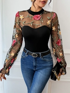 Close-up of floral embroidery on sheer mesh long sleeve bodysuit with high neck