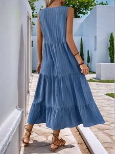 Detailed view of sky blue tiered maxi dress with crinkle texture for summer vacation
