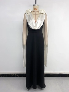 Close-up of elegant V-neck contrast dress with white handmade 3D rose flower details