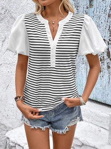 Detail of summer striped T-shirt featuring white puff sleeves and three-button neckline