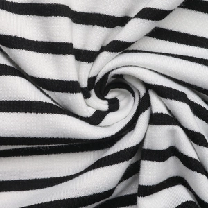 Detailed macro view of black and white striped knit fabric texture and soft pleats