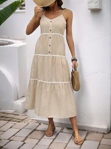 Summer striped maxi dress with lace trim and tiered skirt for beach vacations