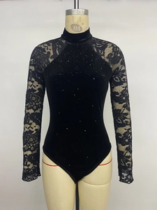 Detail of elegant black velvet bodysuit with lace sleeves and shimmering silver sequins