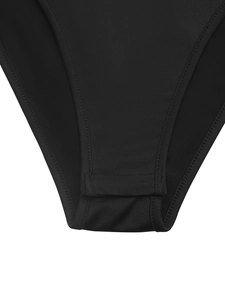 Close-up of the snap button closure and fine stitching on a black lace bodysuit