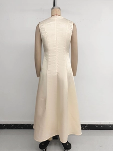Detail of champagne satin dress showing seamless waistline and invisible zipper closure