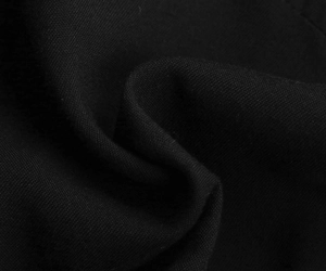 Close-up of the black woven fabric texture on this summer button-down midi dress