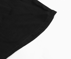 Detail of double-needle stitching and high-quality knit fabric on black dress hem