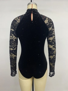 Detail of high collar bodysuit featuring velvet glitter texture and floral lace sleeves