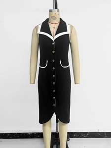 Detail view of contrast white piping on lapel and gold buttons of black sleeveless dress