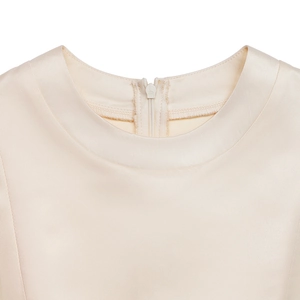 Detail of the champagne satin dress neckline with a hidden back zipper closure