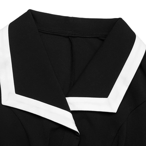 Detail of elegant black dress showing sailor collar with white contrast stripe trim