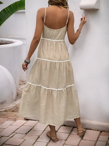 Striped summer sundress with tiered ruffle hem and lace trim in a light khaki vacation style