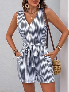 Detail of blue and white striped romper with deep V-neck and vintage wooden buttons