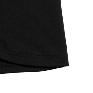 Detail shot of the double-needle stitched hem on a slim contrast lapel sleeveless dress