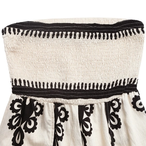 Detail of smocked chest design with ethnic floral print on cotton linen jumpsuit