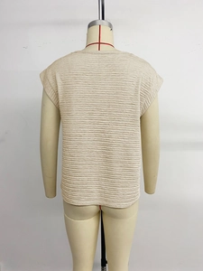 Detailed back view of beige casual t-shirt with unique crinkle texture on a mannequin