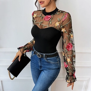 Sexy black long sleeve bodysuit featuring sheer lace mesh and vibrant floral embroidery