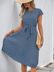 Detail of blue geometric print midi dress with flutter sleeves and adjustable waist belt