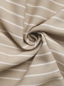 Macro shot of striped fabric showing texture and soft draping on summer sundress