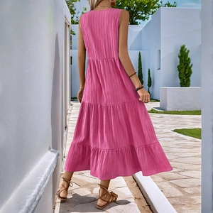 Hot pink tiered maxi dress with V-neck sleeveless cut and pleated texture for summer