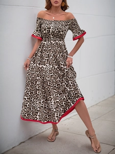 Detailed macro view of the ruffled sleeve with leopard print and red piping accent