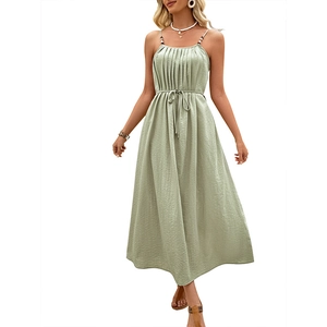 Sage green sleeveless maxi dress with thin straps and waist tie in a loose A-line fit