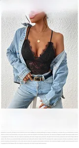 Detail of sexy deep V-neck black floral lace bodysuit with eyelash lace trim and denim styling