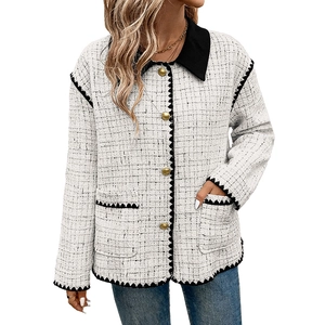 Women's black and white tweed jacket with gold buttons and elegant black trim detailing