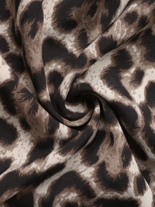 Detailed macro view of retro leopard print fabric with soft texture and elegant drape
