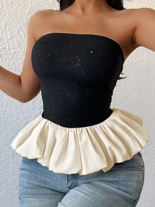 Sparkly black strapless top with oversized cream ruffle hem and silver rhinestones